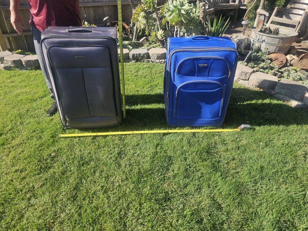2 Expandable Rolling Suitcases - $20