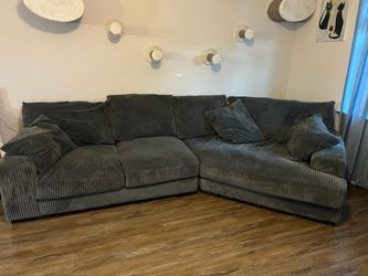 Sectional sofa with cuddler piece