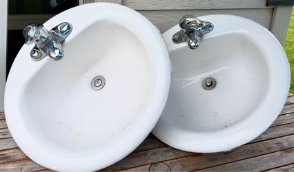 Pair of White Oval Drop-In Bathroom Sinks with Faucets