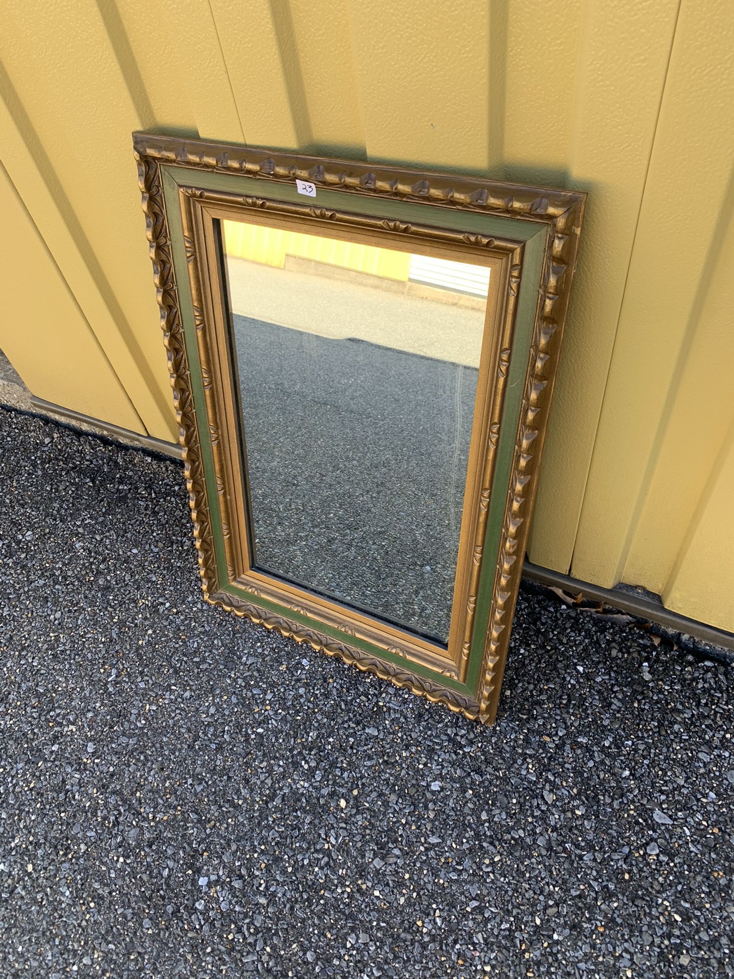 Green and gold wall mirror