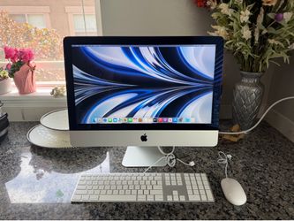 21.5” Apple iMac with Apple wired keyboard and mouse