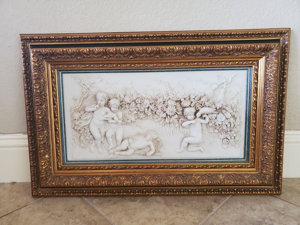 Antique cherubs sculpture with beautiful wood frame