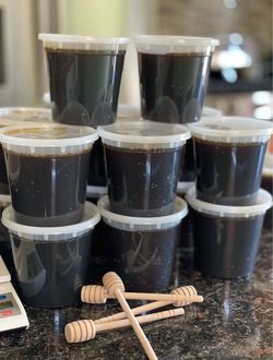 Raw Dark Honey in Plastic Containers