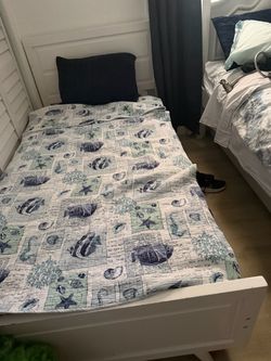 White twin side bed