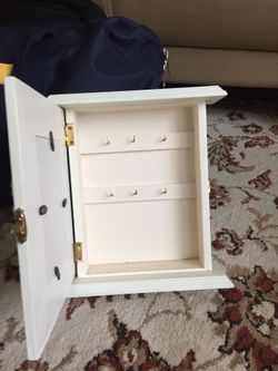 Photo frame with jewelry cabinet
