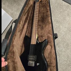 Electric Guitar And Case 