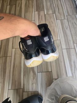 Air Jordan 11  Black Patent Sneakers