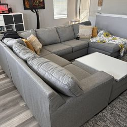 Ashley’s Grey Sectional & Ottoman 