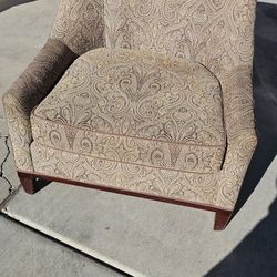 Vintage paisley upholstered accent chair by Charter furniture good condition 1 leg is different 