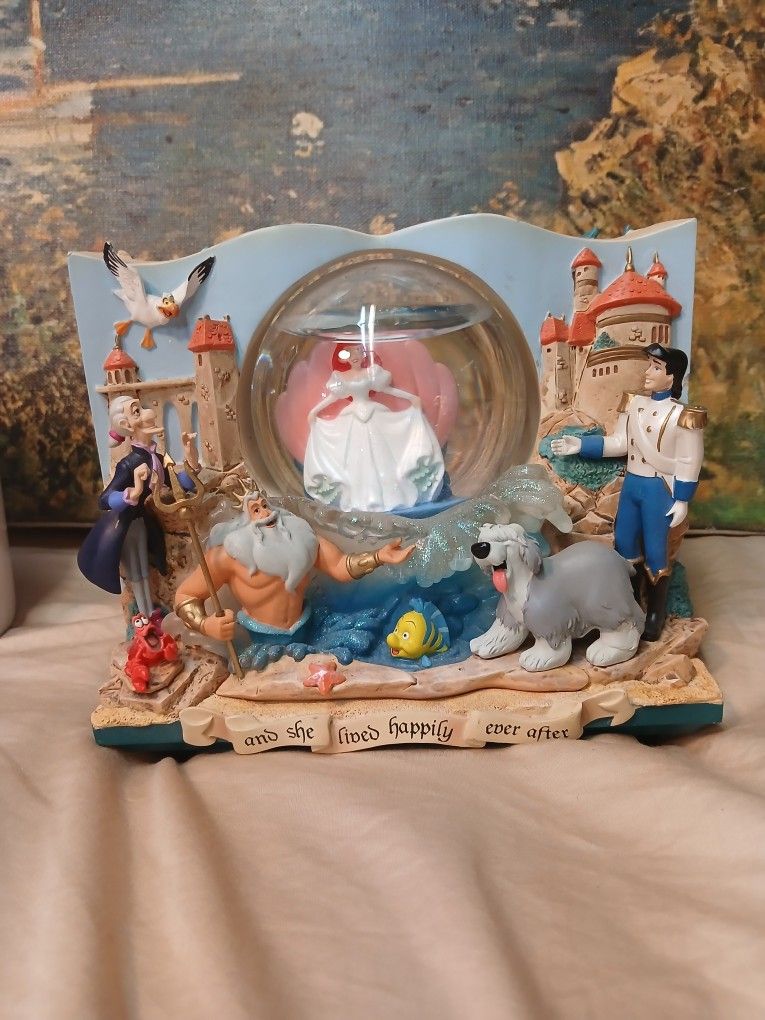 This Disney Little Mermaid Storybook Double Sided Musical Under The Sea Snow Globe is a must-have for any Disney fan. 