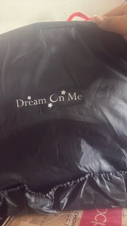 Portable travel bassinet by Dream on Me, and is black