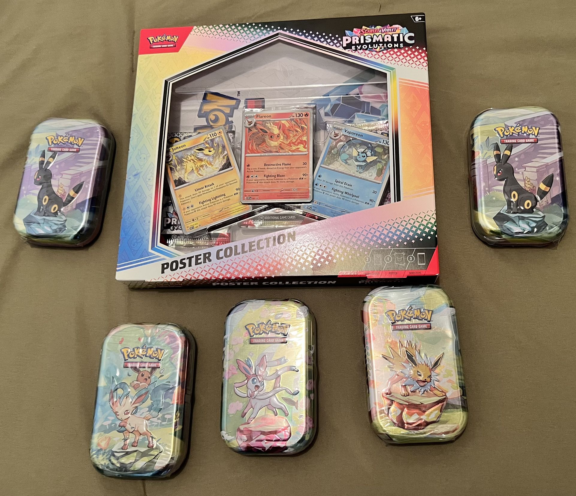 Prismatic Evolutions Poster & Mini Tins