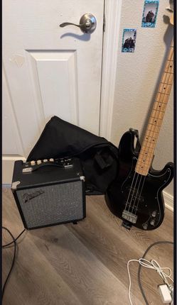 Fender Bass Guitar, amp, gig bag, and guitar strap