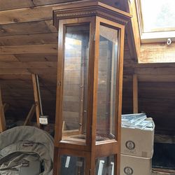 Curio cabinet with shelves and a light