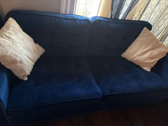 Two navy blue velvet love seats