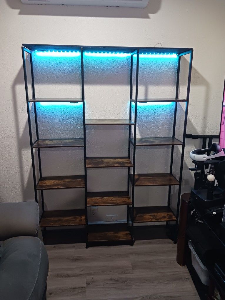 Nice shelf   Good Condition.  50 inches long,  x 68 inches tall.   With Led lights.