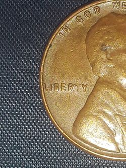 1957 d Lincoln penny colectible doubl die in back side and error liberty word error