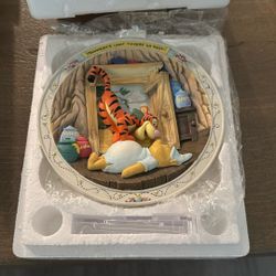 A collectible 3D plate featuring Winnie the Pooh characters, titled 'Three Cheers for Pooh'.