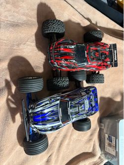 Two Traxxas rustler rc cars