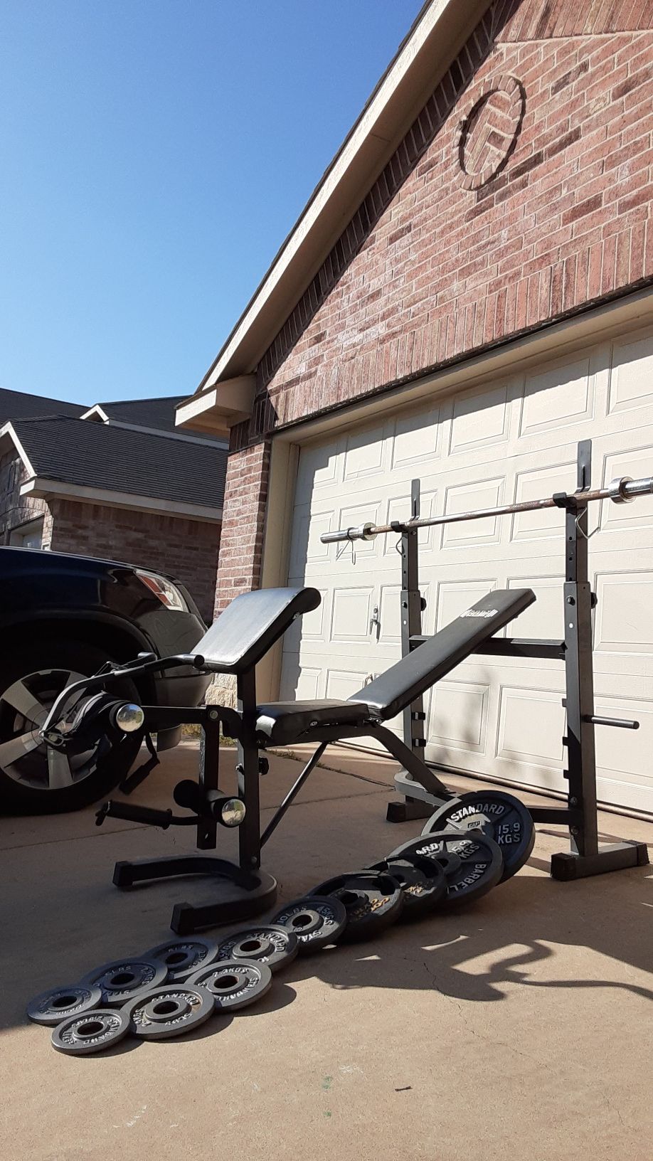 Bench press with lots of features comes with weights and bar