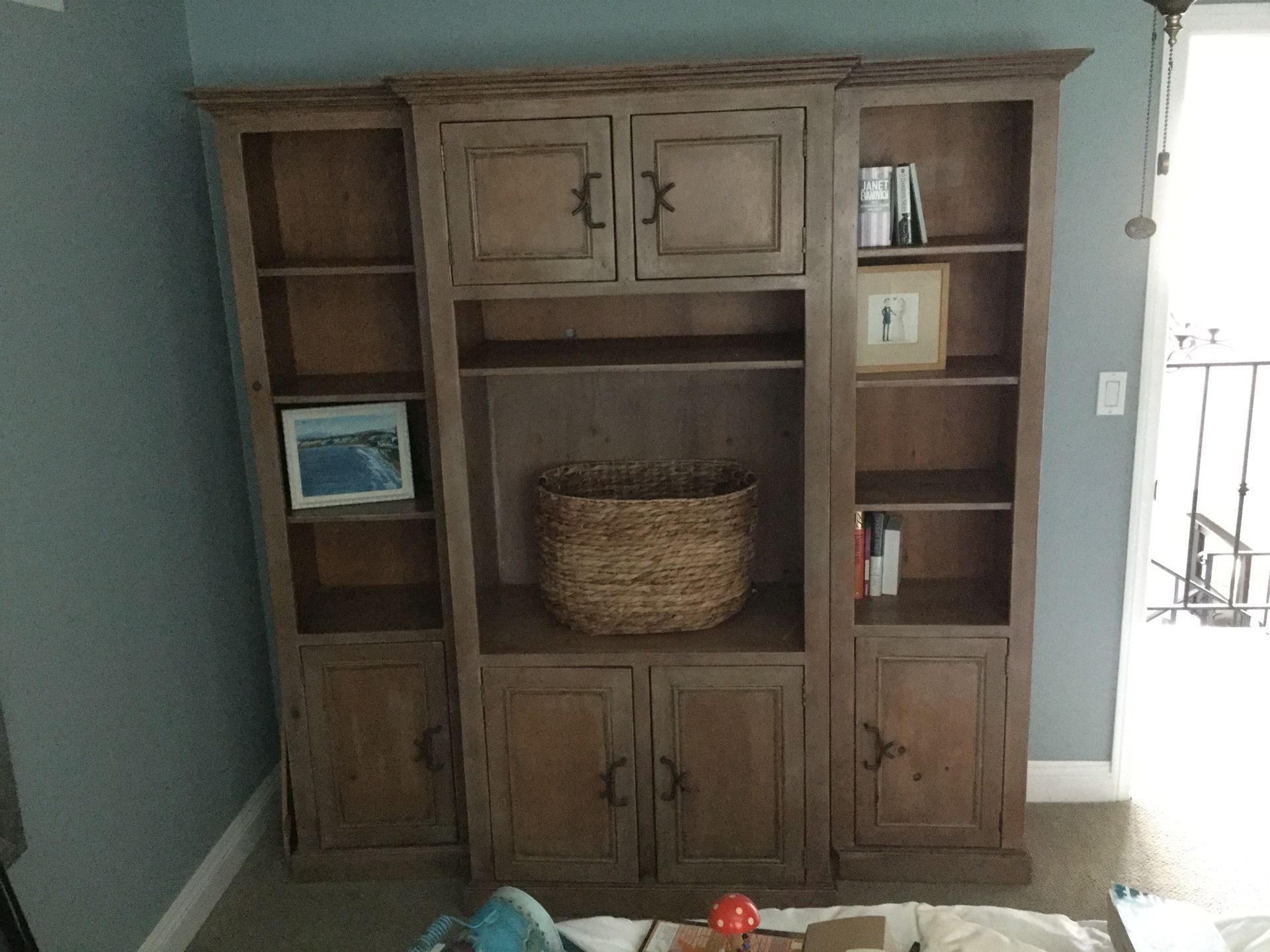 Light wood wall unit with storage and open shelving