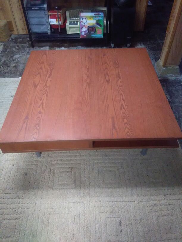 Nice coffee table has cubby holes drawers it's an Ikea kaffatorp