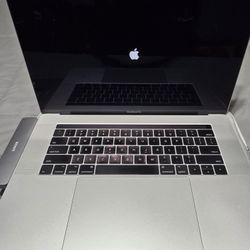 2017 MacBook Pro 15" in good condition w/ laptop sleeve, OEM charger and cable and Anker hub