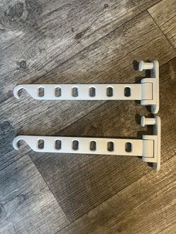 Metal hangers to hook to wall to add extra space to hang clothes if you don’t have enough room in your closet, maybe a wall with nothing on it. You ca