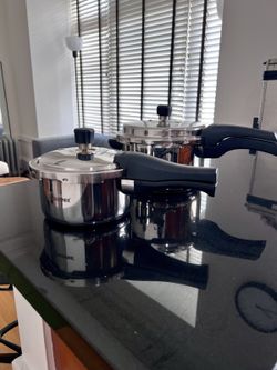 Small Bergner stainless pressure cooker with lid + larger cooker — pair