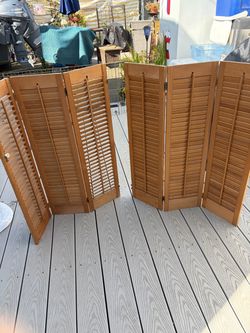 Two wood window shutters