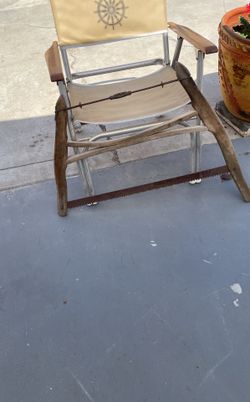 Antique Saw And A Weed Trimer