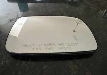 Passenger side mirror. Toyota Camry. Like New. Snaps right in.