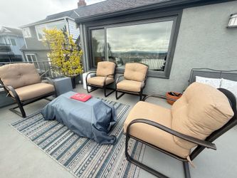Set of four very comfortable and a cushy upholstered outdoor armchairs with bouncy cantilevered base.