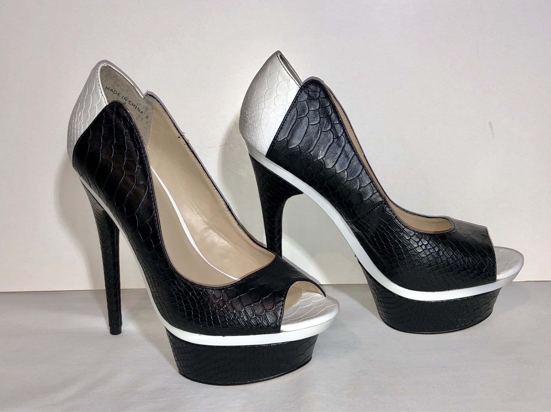 Women’s classy black and white Bebe Stiletto Platform heels - shoes size 8