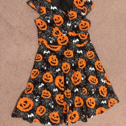 Fun Halloween dress featuring bright orange jack-o'-lanterns and white ghosts on a black background.  New L pumpkin Halloween dress pin up retro dress