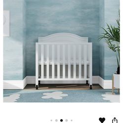 DaVinci Charlie Folding Portable 3-in-1 Convertible Mini Crib and Twin Bed in White,