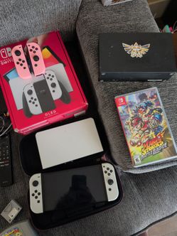 Switch OLED with 7 games, extra controller, and extra dock.
