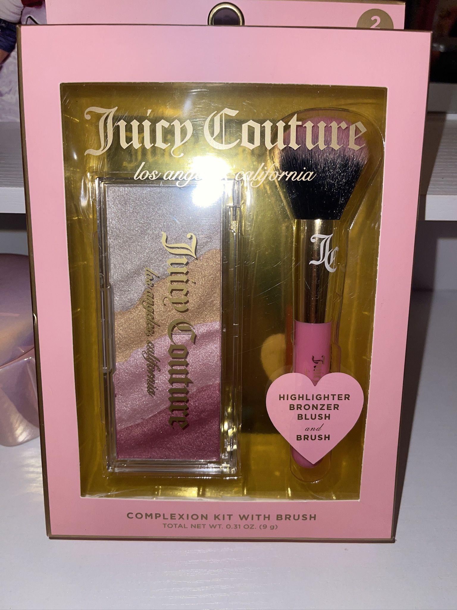 Juicy Couture highlighter bronzer blush and brush