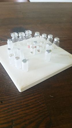 Miniature kitchen jars, some with labels