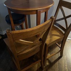 Round Table With Stool And Two Tall Wooden Chairs