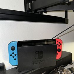 Nintendo Switch with Neon Blue and Neon Red Joy-Con