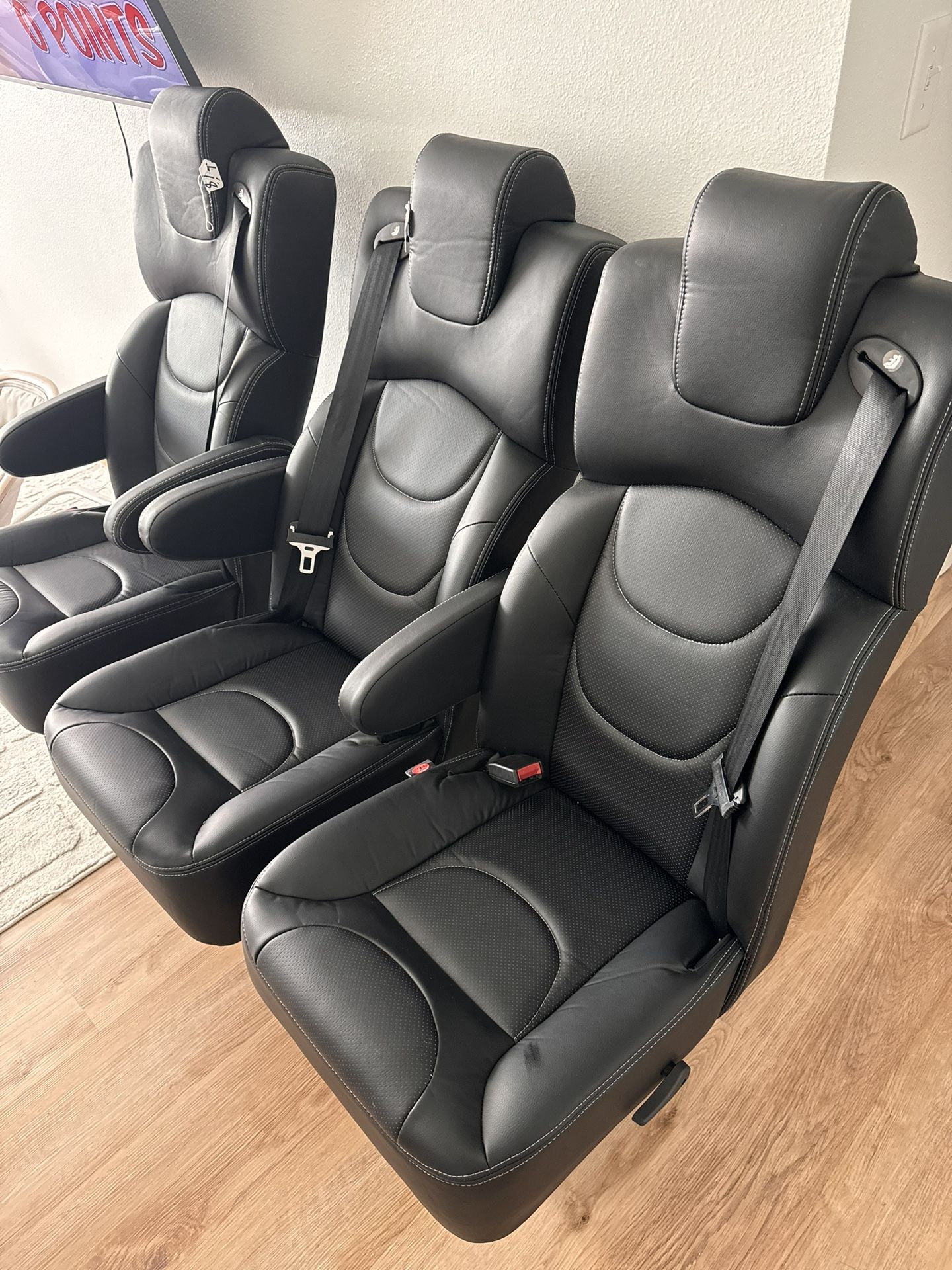  three Captain's chairs with swivel, recline and slide functions. 