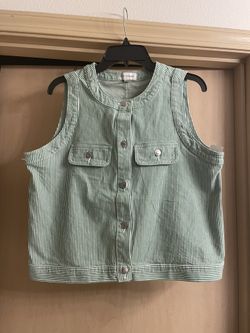 Brand new adorable women’s size medium green and white denim vest