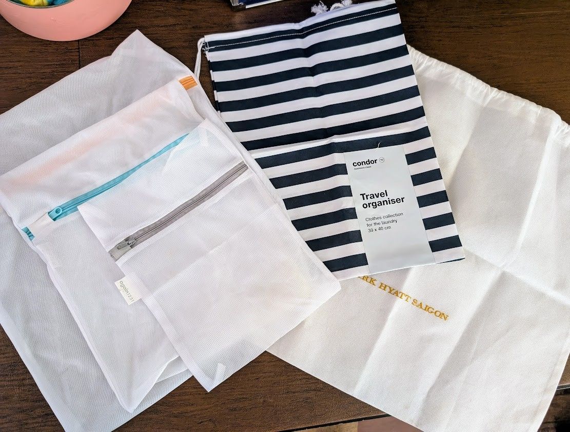 Set of 3 mesh zippered bags ($5) and two laundry washable drawstring bags ($2 - $3)