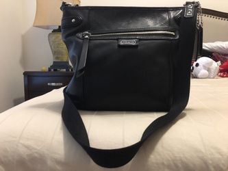 Coach cross by bag