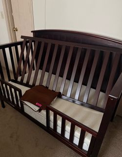 Kids bed 4 in 1 Convertible Crib in espresso with Mattress, mattress pad, crib bumper and 2 bed rail guards. Like new.