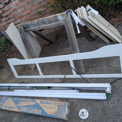 FREE tube light, bulbs. plus boxes of shorter bulbs unused and socket, shutters, sawhorse, cement board