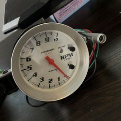 Equus Performance Back-Lit Tachometer with a shift light. 