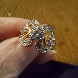 Brand New Zircon Gold Tone Ring. Size 4