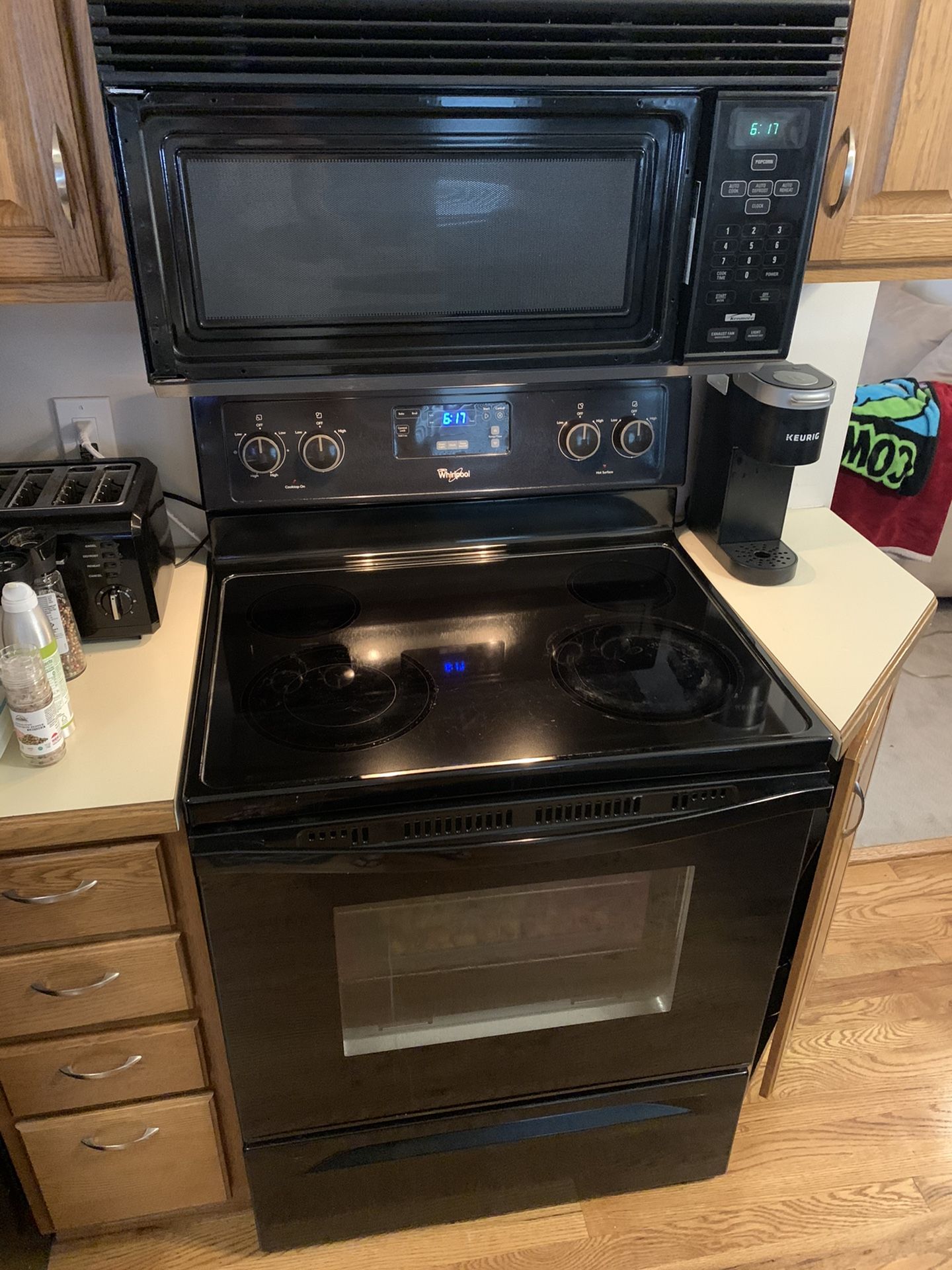 Whirlpool black electric stove and microwave